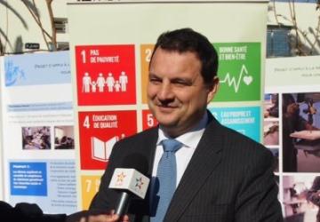 Image shows Philippe Poinsot being interviewed in front of an SDG banner
