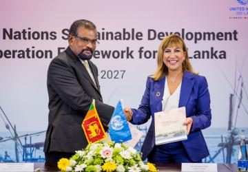 A man and a woman shaking hands. 