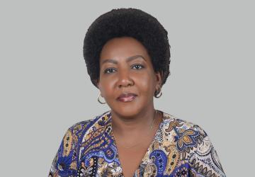 A woman a purple coloured shirt