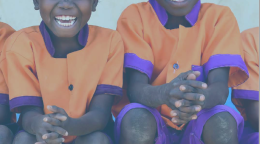 This document has white text and a picture of two children in an orange shirt and purple pants