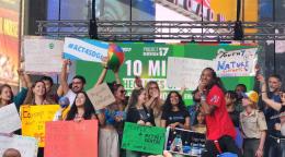 A group of people gathered on a stage in Central Park