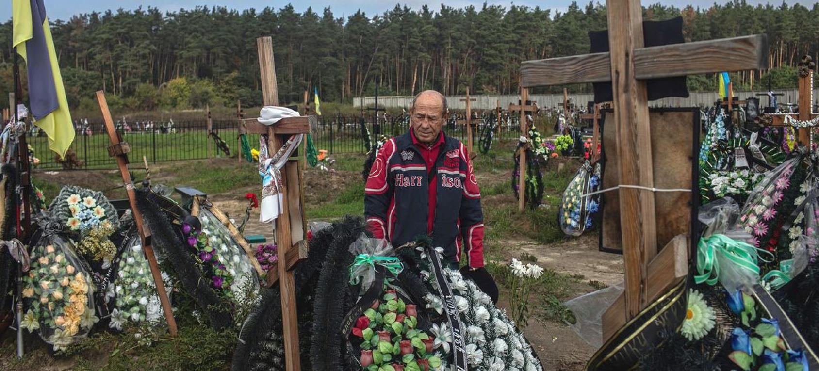 Man standing in a cemetery