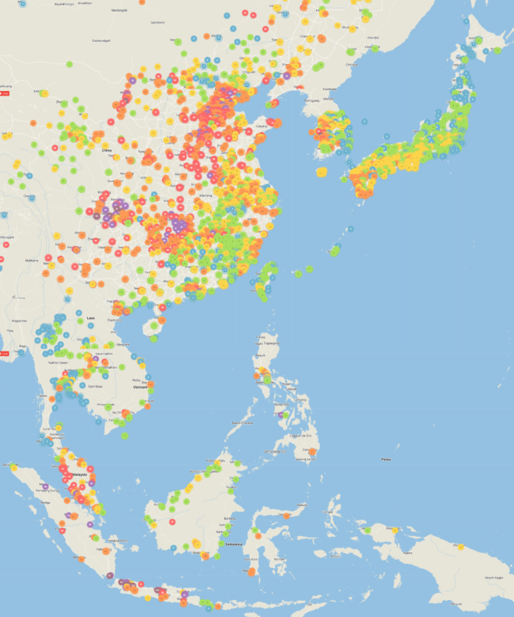 A map of east asia with several small dots in different colours depicting air quality