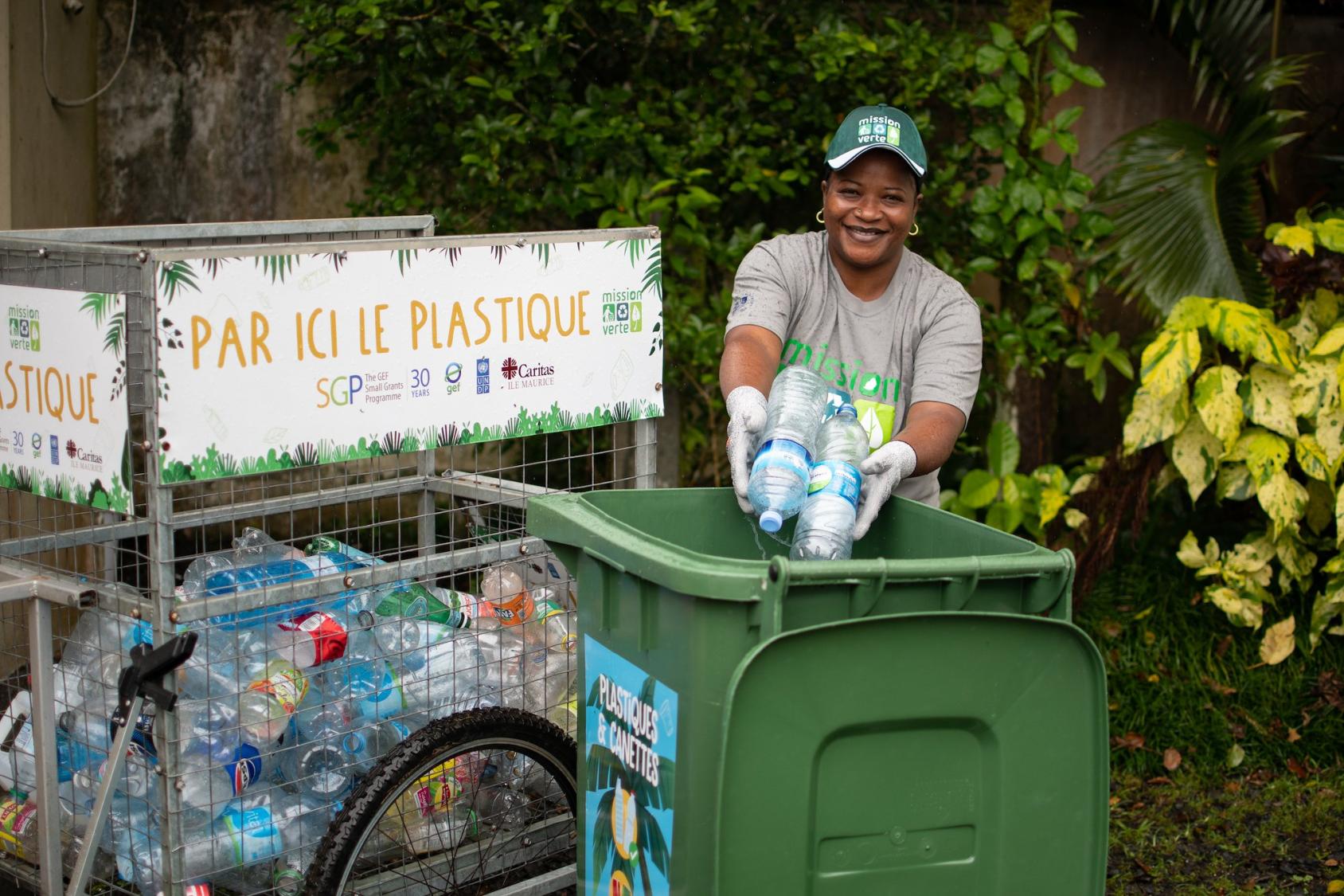 Christina Perrine throwing bottles in a bin