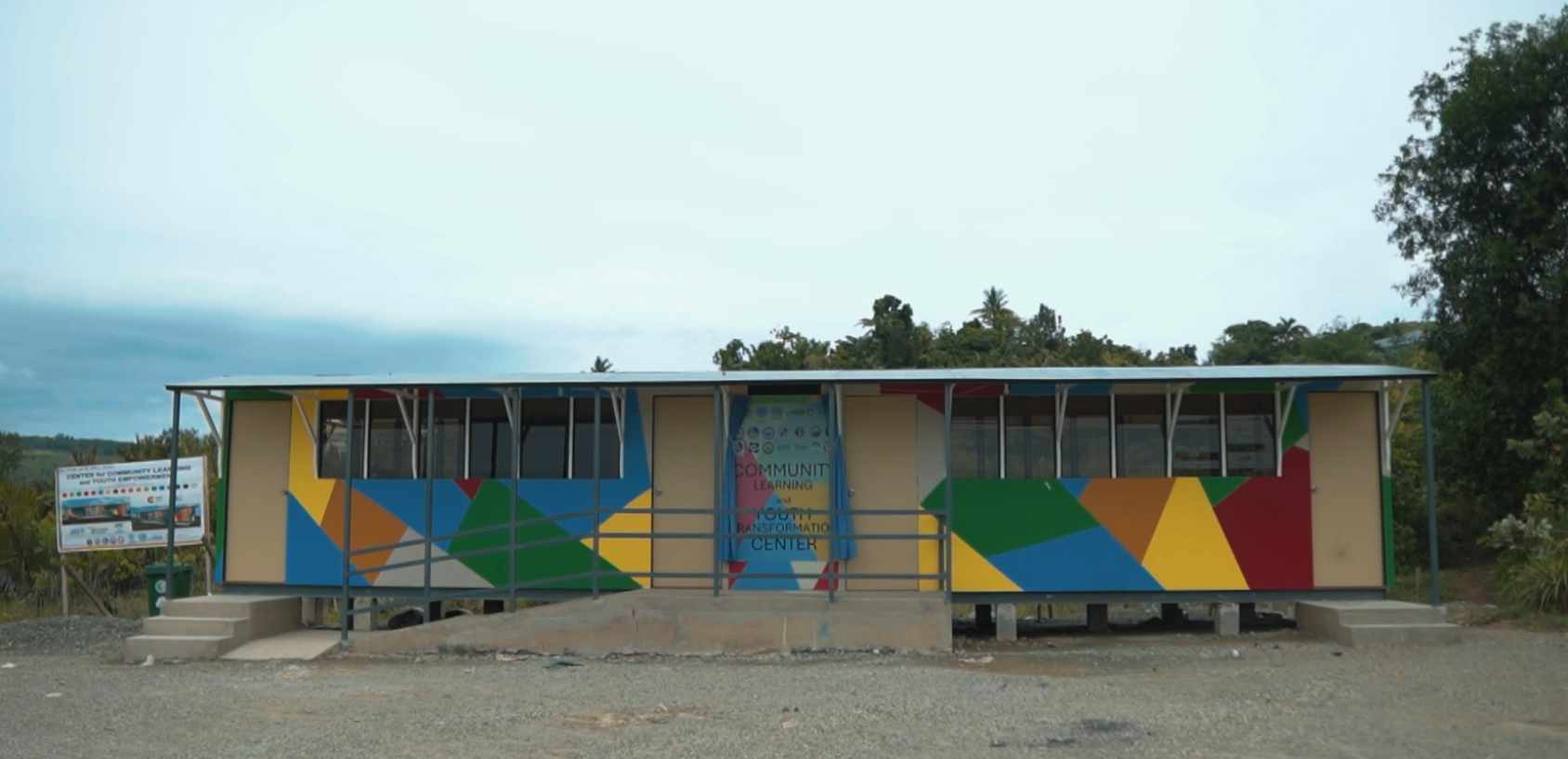 A colourful building erected in a scenic location