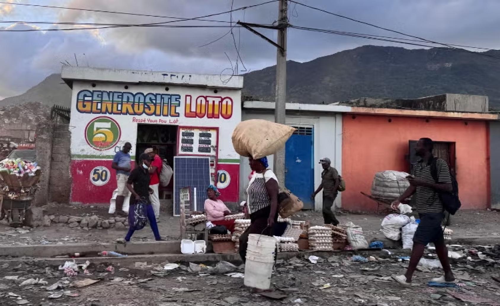 People walking through the garbage with their belongings