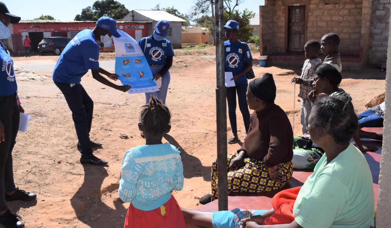 Community volunteers in Lusaka speaks to community members about COVID-19 as part of community sensitization on the virus. 