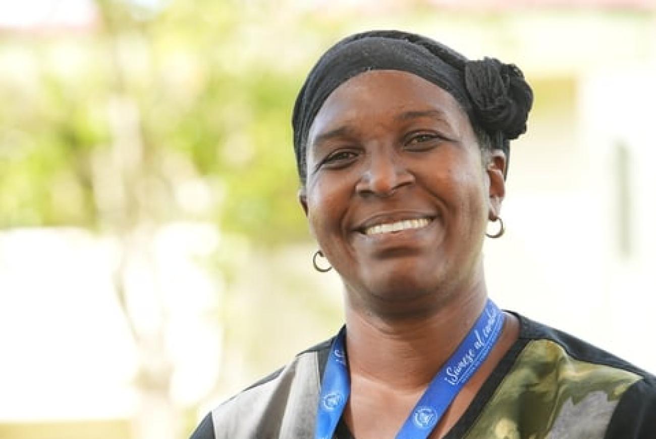 Portrait of a smiling woman looking at the camera.