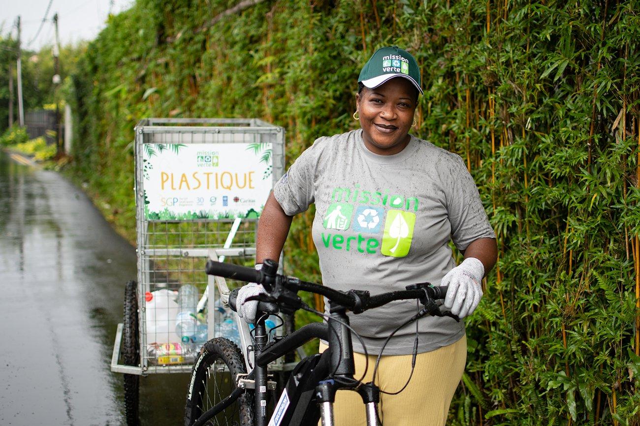 Christina Perrine collecting rubbish by bike