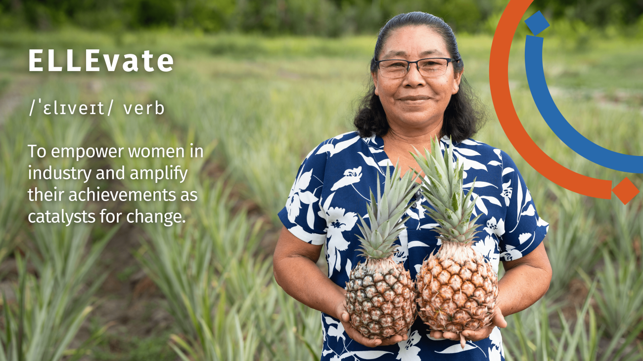 A woman in a blue colourful shirt with a graphic
