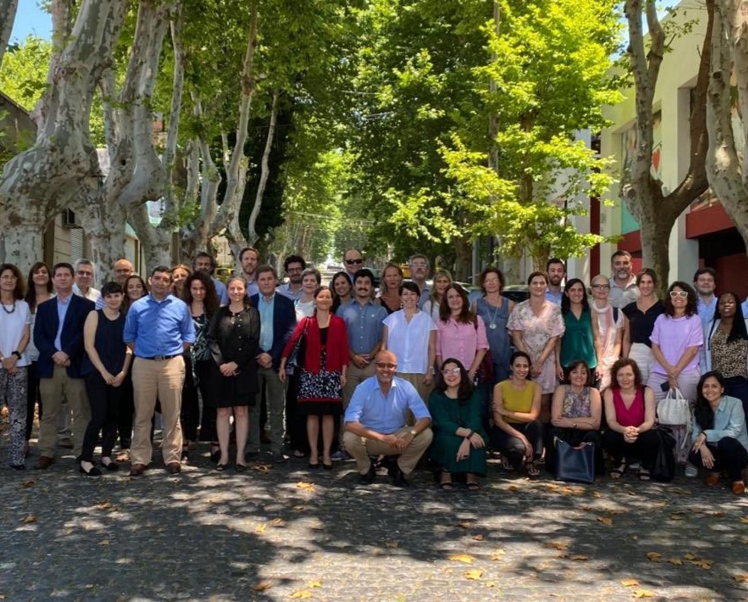 Photo shows the UN Teams from Argentina and Uruguay posing in front of a tree.
