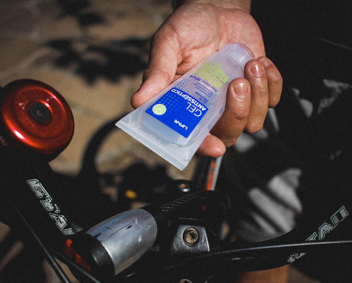 Matheus Martinez, 27, holds the hand sanitizer he carries with him on deliveries.