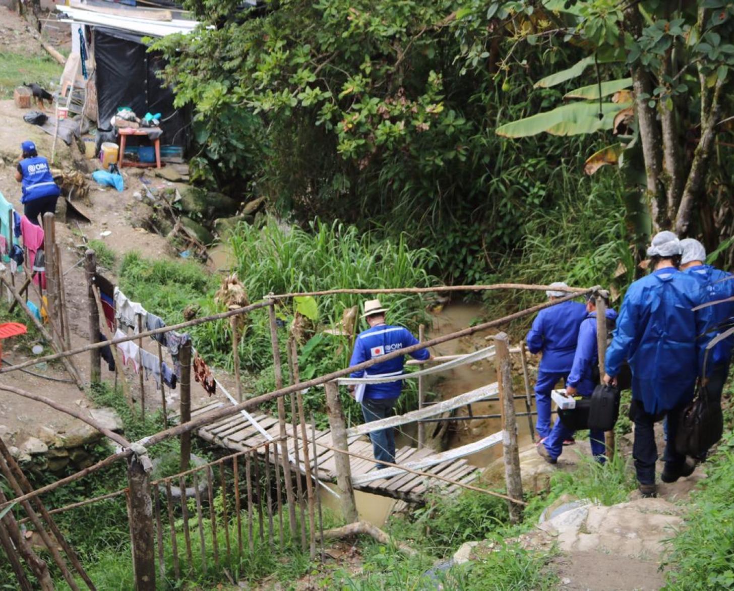 UN staff walk down to meet families in the most remote areas of Brazil.