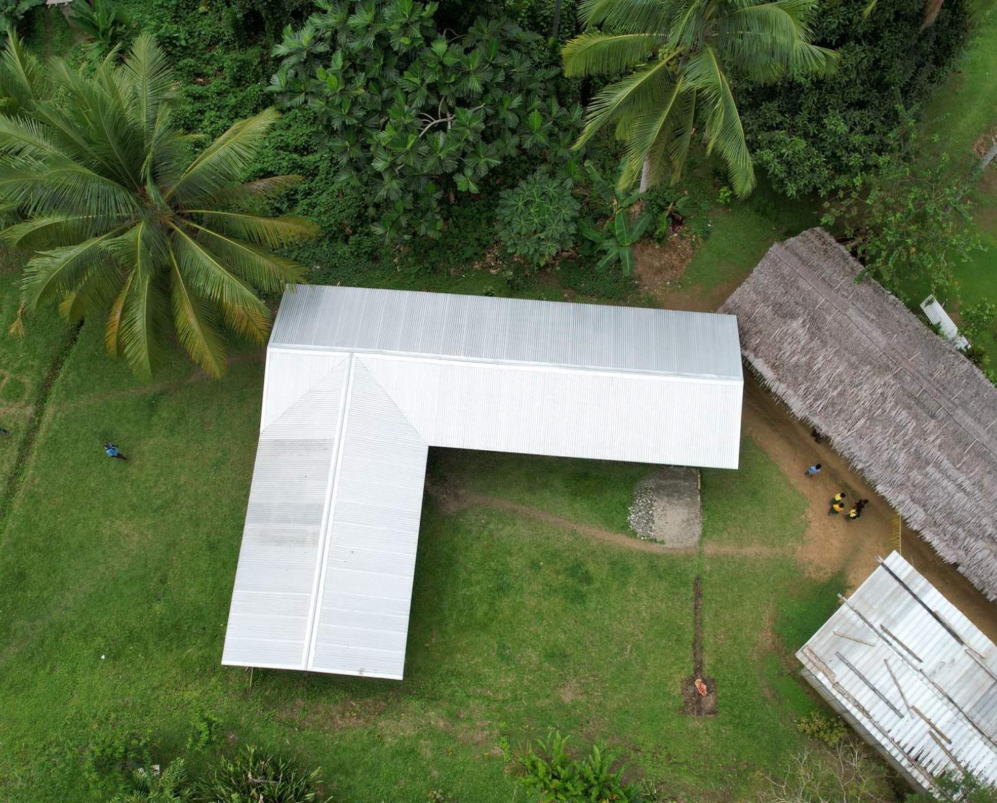 The new permanent-structure elementary classroom built by the Hambini villagers, replacing the old space for children's education. 