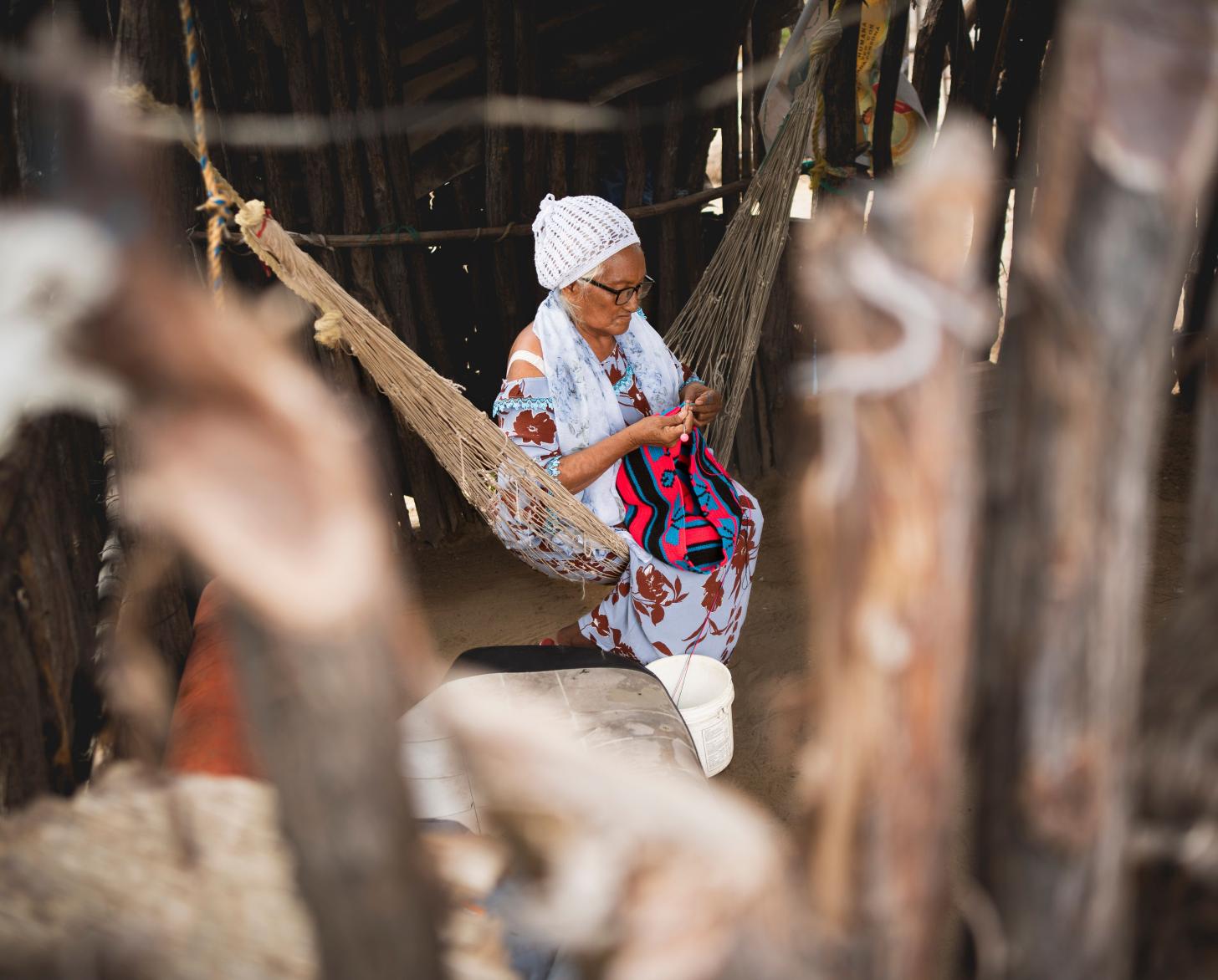 Freyla González, senior weaver of Paraguaipoa weaves Wayúu textiles in her house.