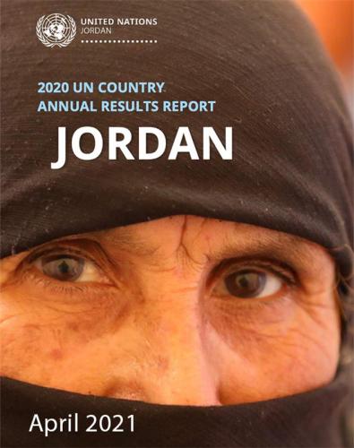 A close up image of a woman's eyes with her mouth and forehead covered by a black hijab.