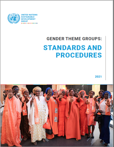 Women wearing orange stand together and proudly show their palms as a symbol to stop. 