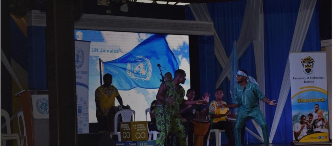 Jamaica section banners shoes performers on stage during UN Day.